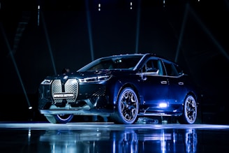 a car on display in a dark room
