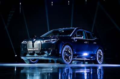 a car on display in a dark room