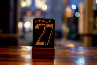 a wooden table with a table number on it