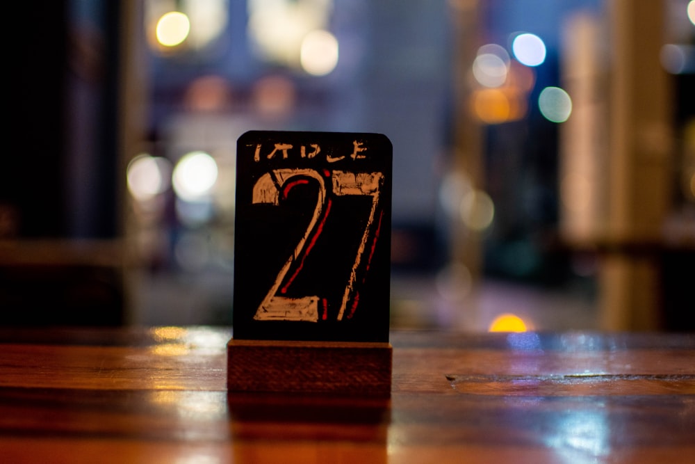 a wooden table with a table number on it