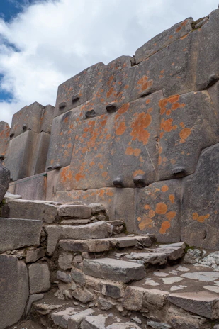 a stone wall with steps leading up to it
