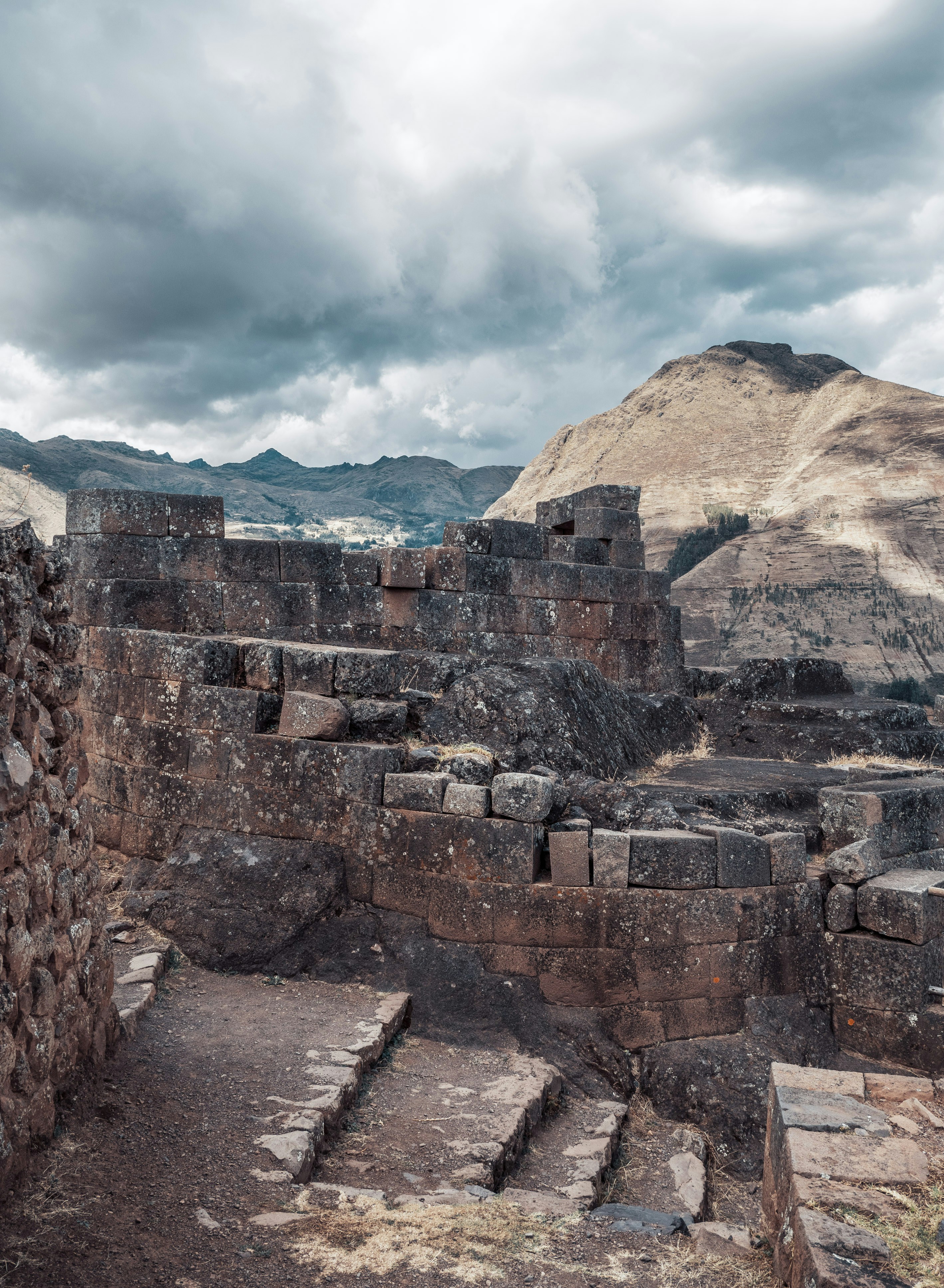 a stone structure with steps leading up to it