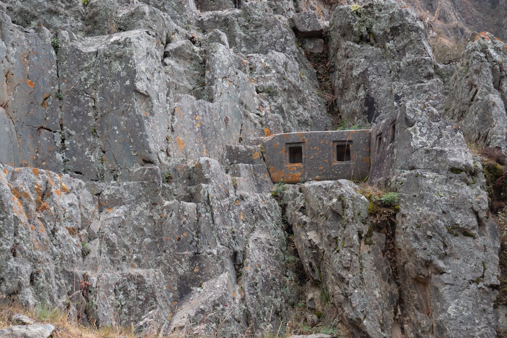 a small building built into the side of a mountain