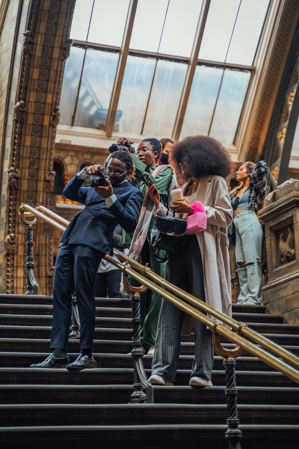 a group of people standing on top of a set of stairs