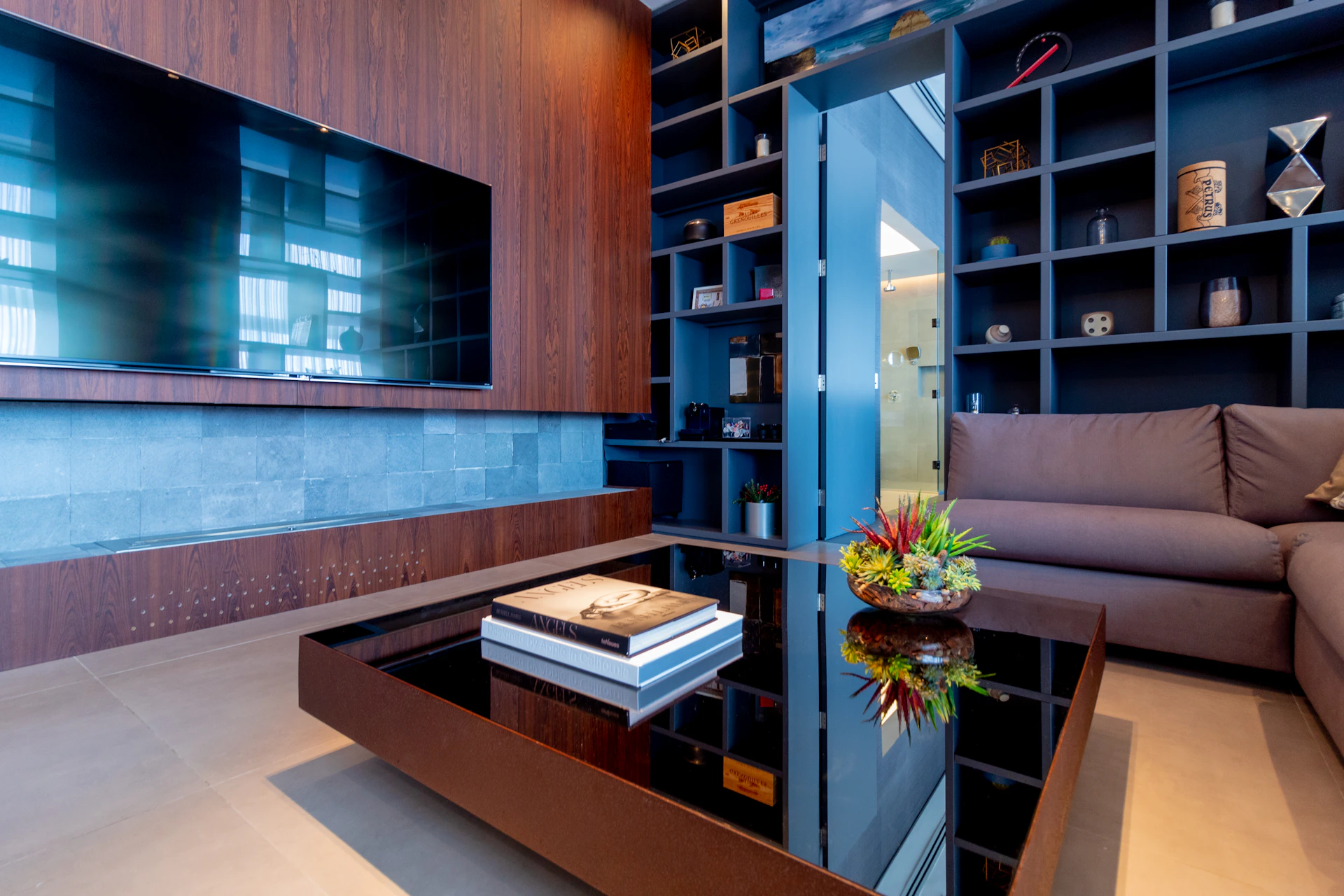 a living room filled with furniture and a flat screen tv