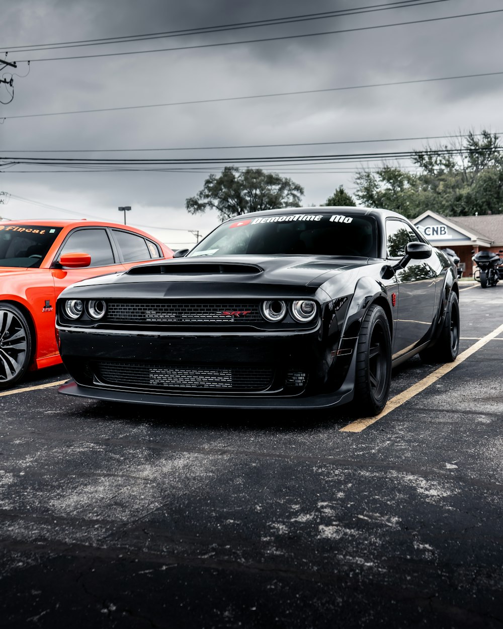 a couple of cars parked in a parking lot