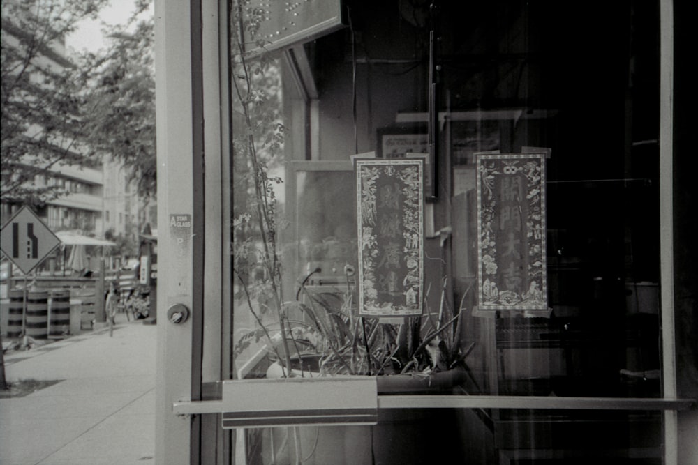 a black and white photo of a store front