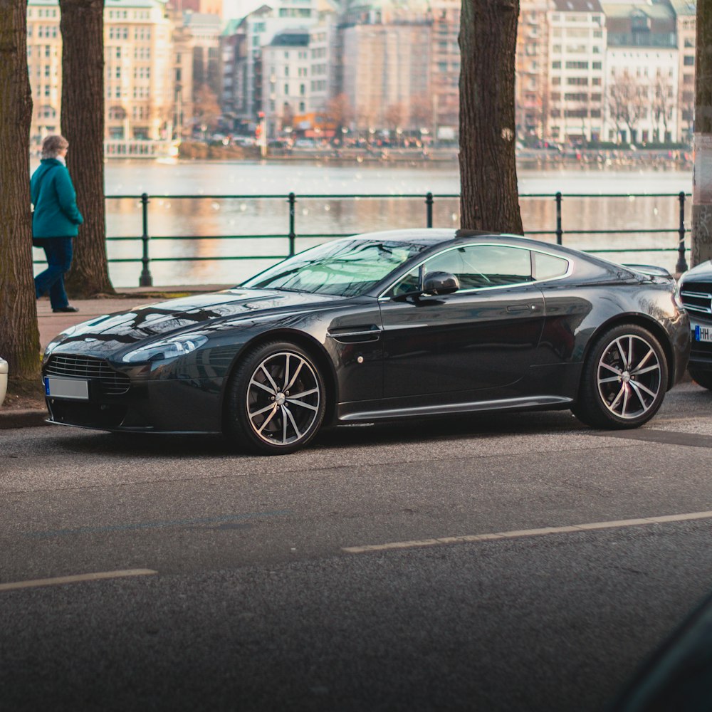 a black sports car parked on the side of the road