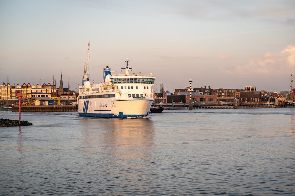 a large white boat in a body of water