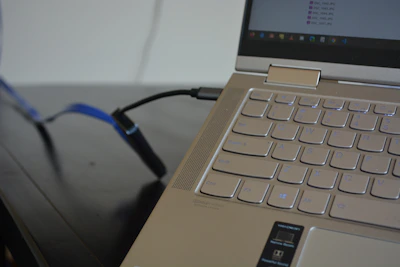 Close-up of hands uploading files on a sleek modern computer screen.