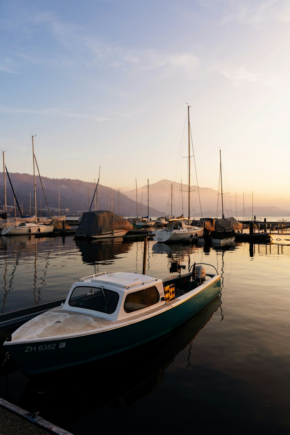 a small boat is docked at a dock