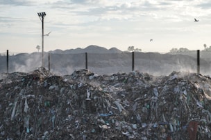 a pile of garbage sitting next to a street light