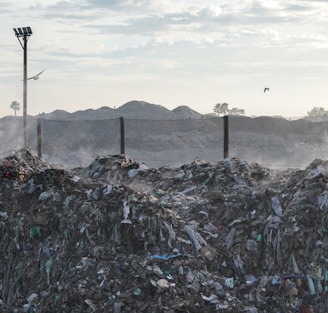 a pile of garbage sitting next to a street light