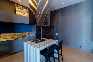 a kitchen with a stove top oven next to a counter