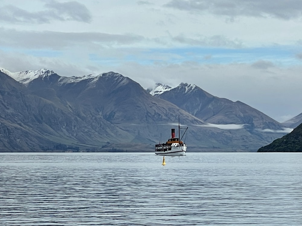 a boat floating on top of a large body of water