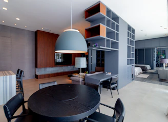 a dining room table and chairs in a room