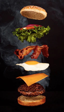 A vibrant burger photo transforming into a dynamic video clip with animated steam and price tag overlay