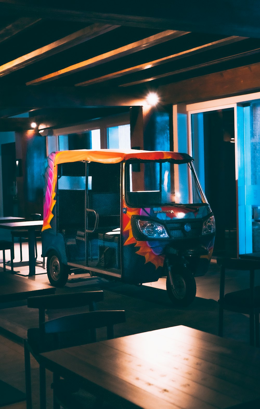 a brightly colored vehicle parked in a restaurant