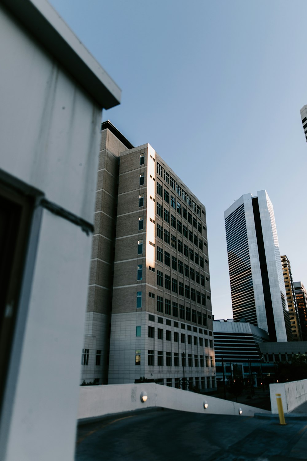 a view of a building from a parking lot