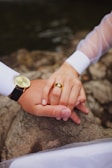A serene image of a couple admiring their custom jewelry together.