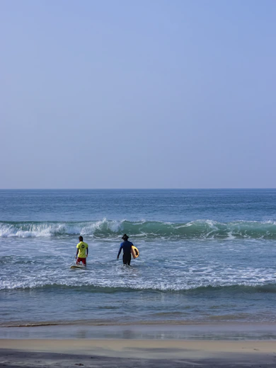 a couple of people that are in the water