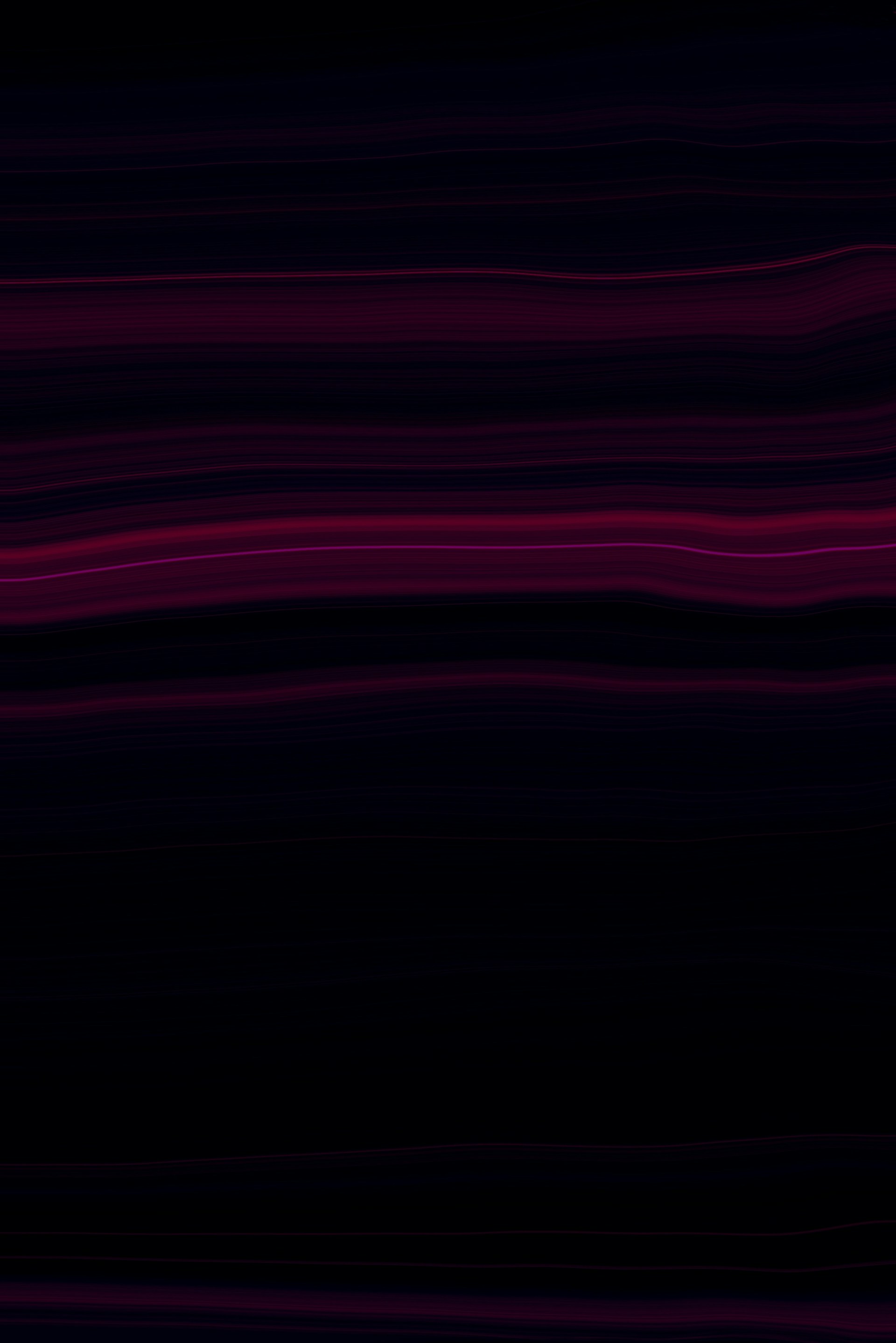 a black and purple background with wavy lines