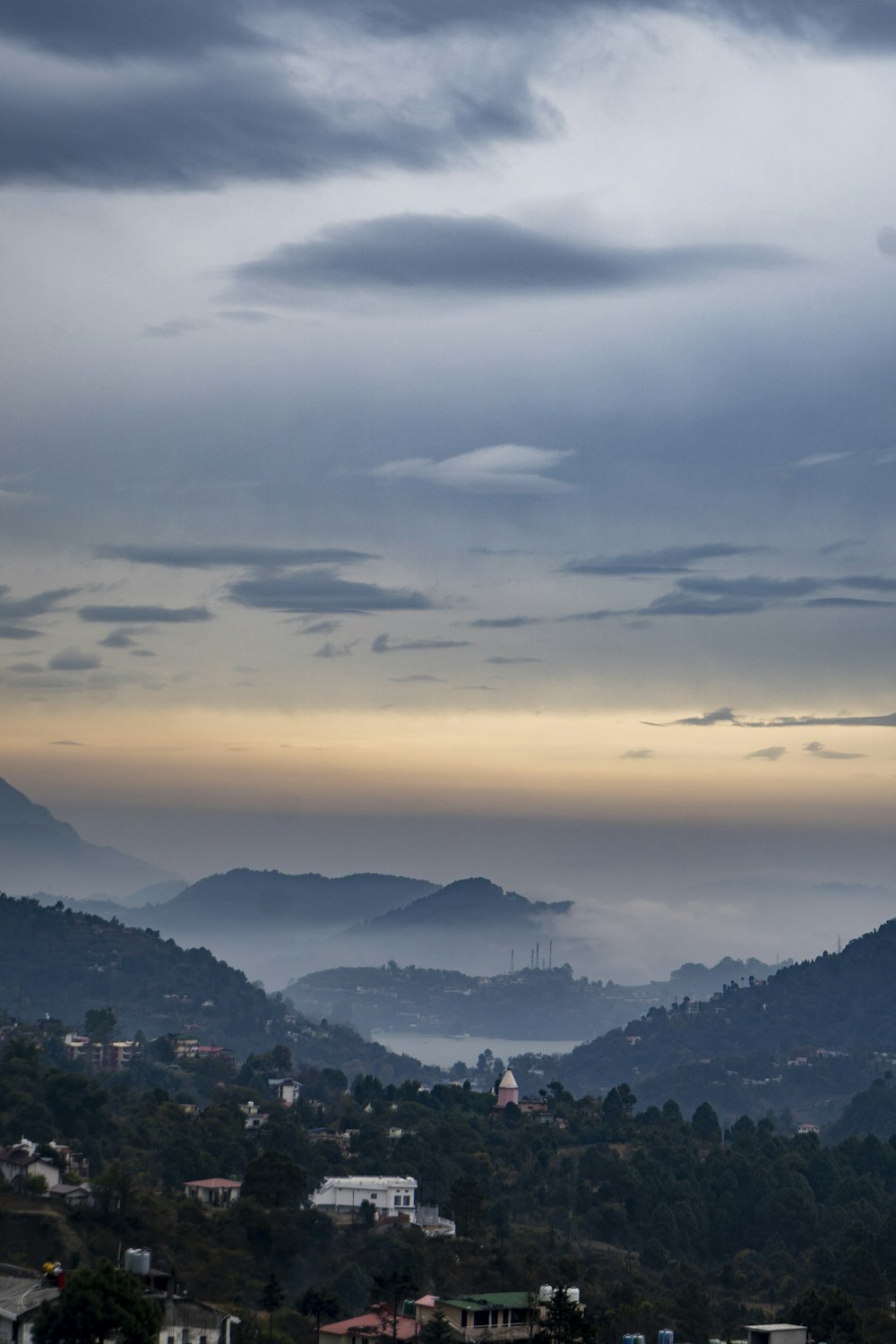 a view of a city with mountains in the background