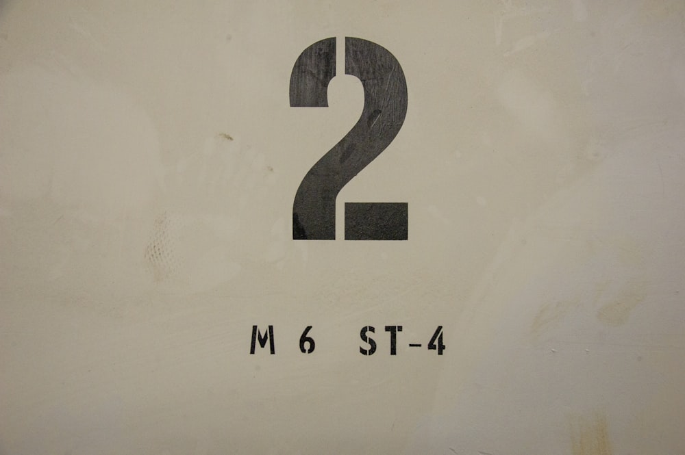 a close up of a street sign with the number two