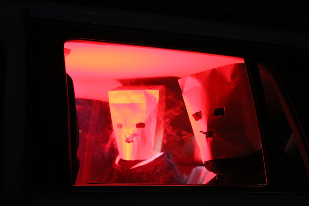 a person in a car with a red light