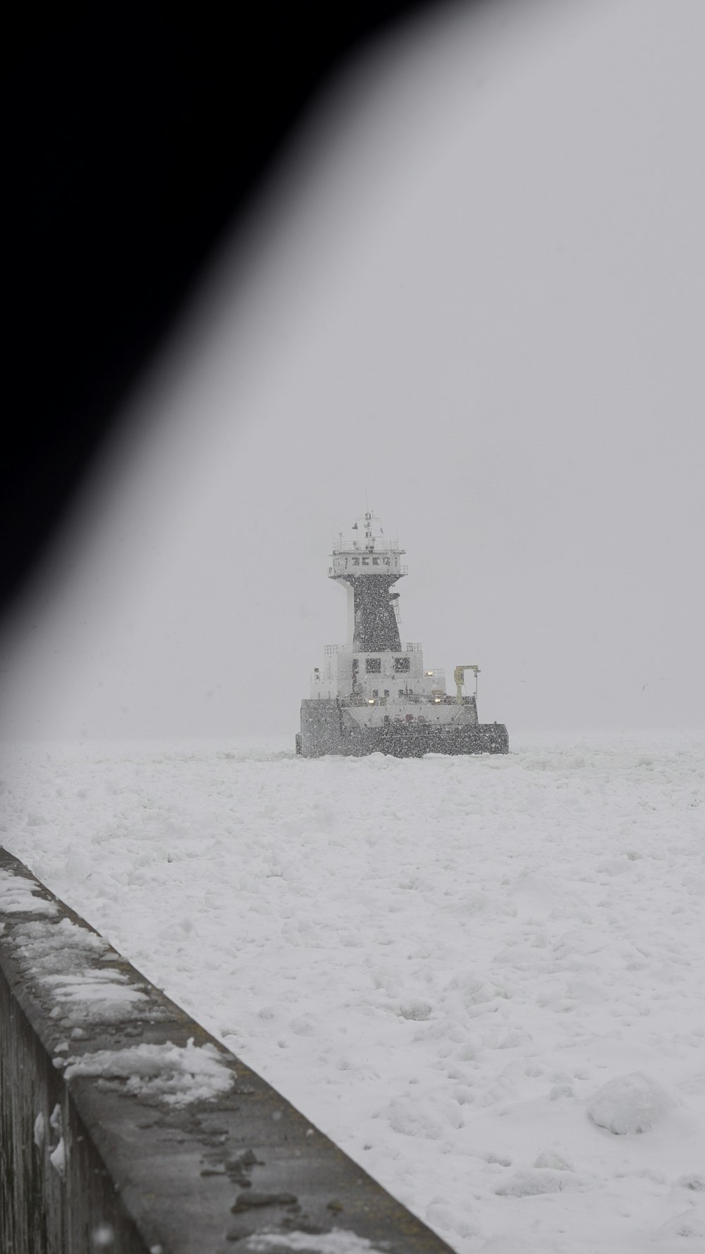 a small boat in the middle of a body of water