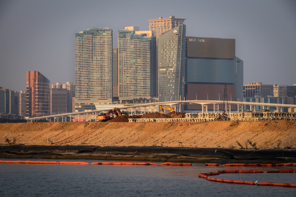 a construction site in front of a large city