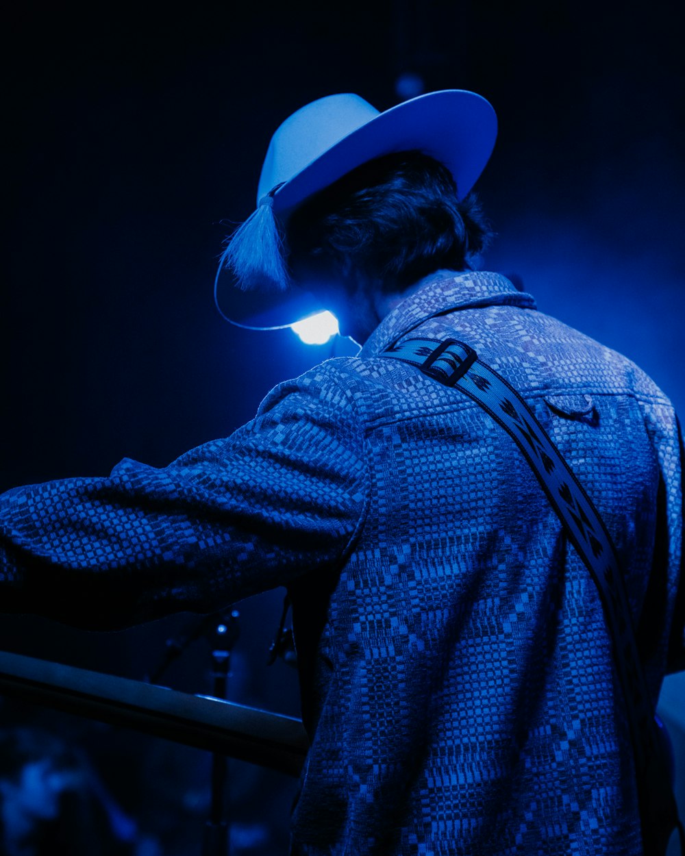 a man wearing a blue hat and jacket