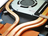 a close up of a hard drive being removed from a computer