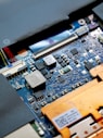 a close up of a computer motherboard with many wires