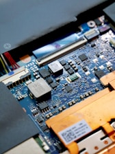a close up of a computer motherboard with many wires