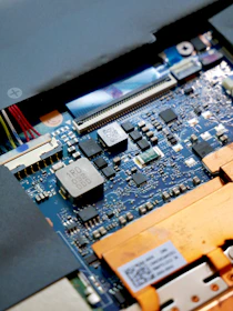 a close up of a computer motherboard with many wires