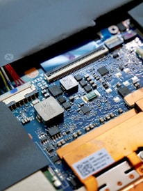 a close up of a computer motherboard with many wires
