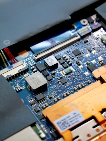 a close up of a computer motherboard with many wires