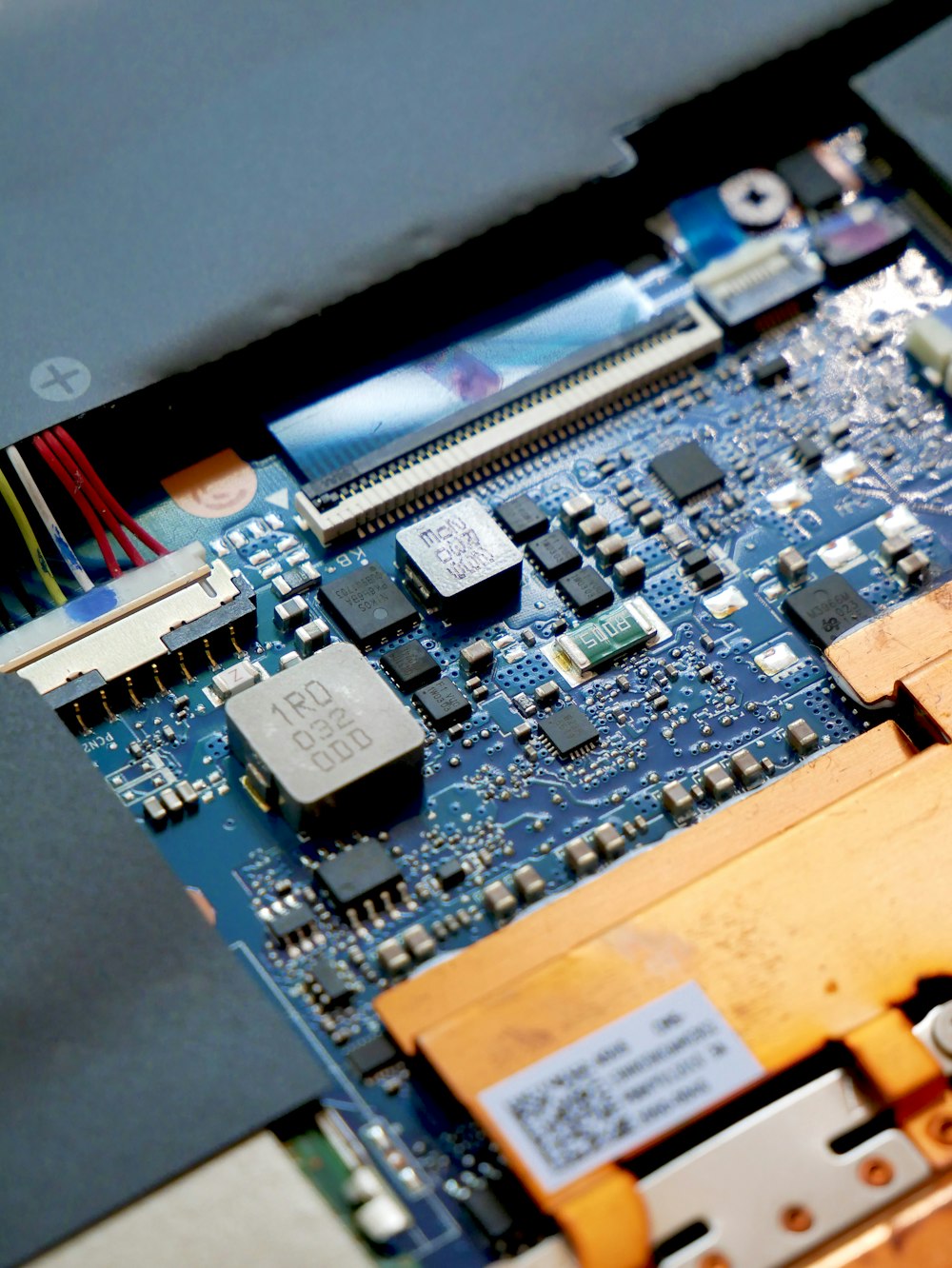 a close up of a computer motherboard with many wires