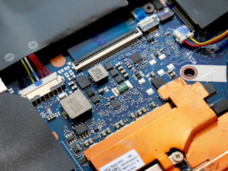 a close up of a motherboard with wires and wires attached to it