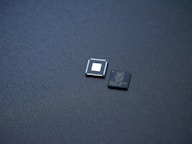 a couple of microchips sitting on top of a table
