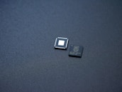 a couple of microchips sitting on top of a table