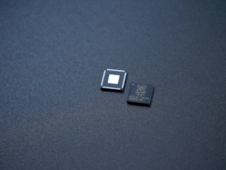 a couple of microchips sitting on top of a table
