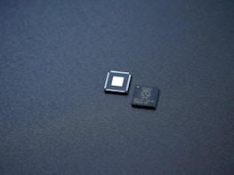a couple of microchips sitting on top of a table