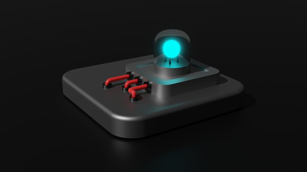 a game controller with a glowing light on top of it