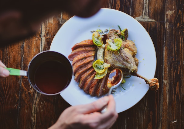 a plate of food and a cup of coffee