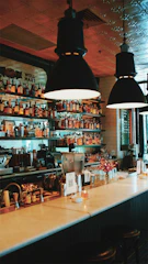 A cozy bar interior featuring a sleek point of sale system in use.
