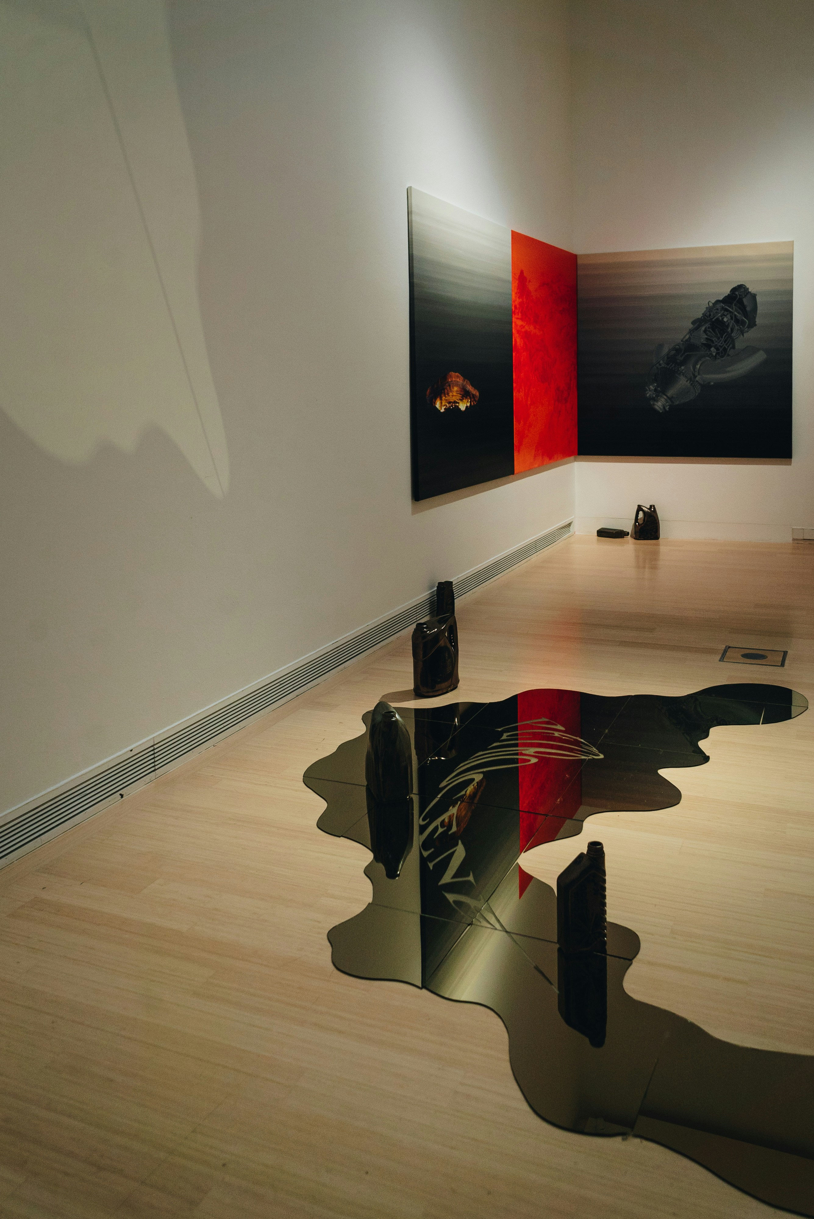 a room with a lot of paintings on the wall