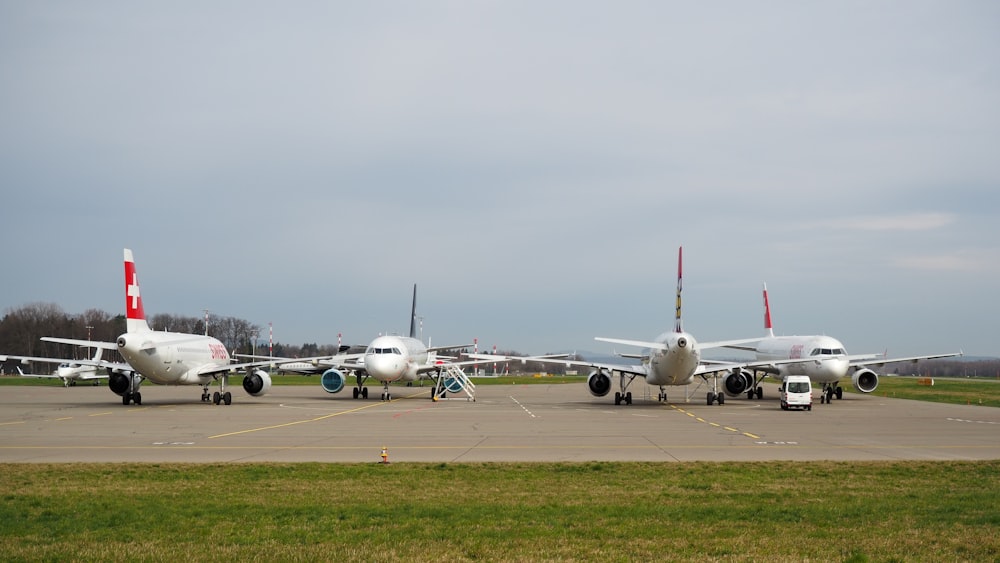 a couple of airplanes that are sitting on a runway