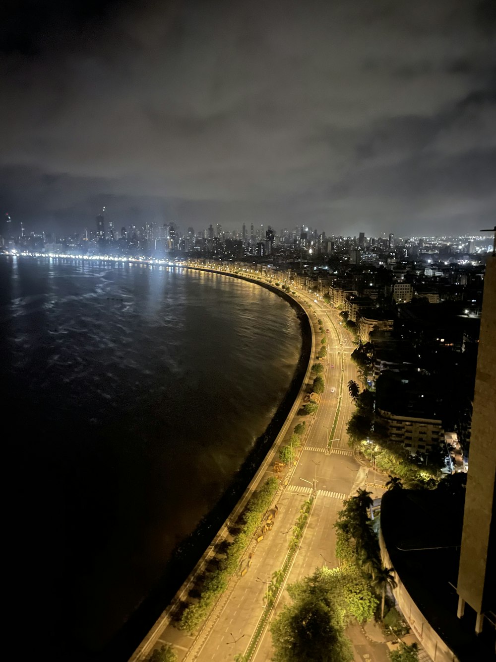 an aerial view of a large body of water at night